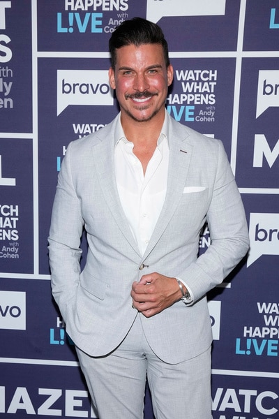 Jax Taylor posing in front of a step and repeat at Watch What Happens Live with Andy Cohen.