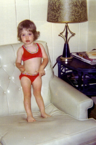 Erika Jayne wearing a red bikini as a child