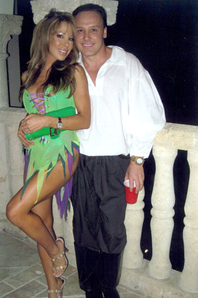 Lisa Hochstein posing in a costume with Lenny Hochstein.