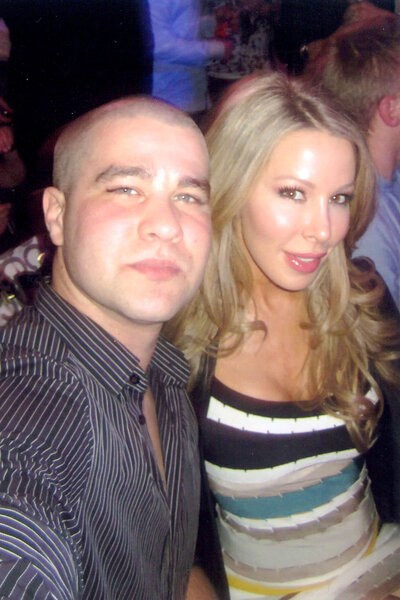 Lisa Hochstein smiling with a friend at a party.