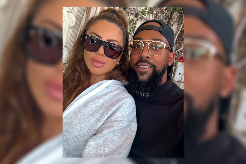 Larsa Pippen and Marcus Jordan pose for a photo together.