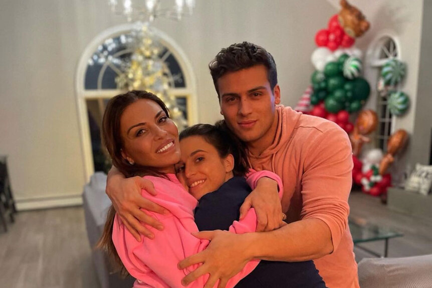 Dolores Catania with her children Frank Catania Jr. and Gabby Catania all posing together.