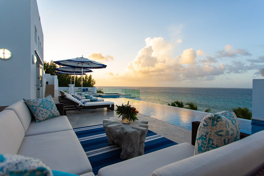 Exterior view of villa's outdoor deck and infinity pool in Anguilla.