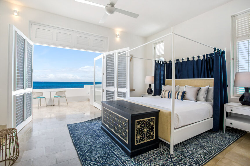 Interior of a bedroom with an ocean view.