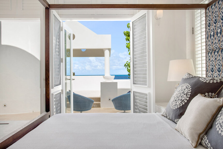 Interior of a bedroom with an ocean view.