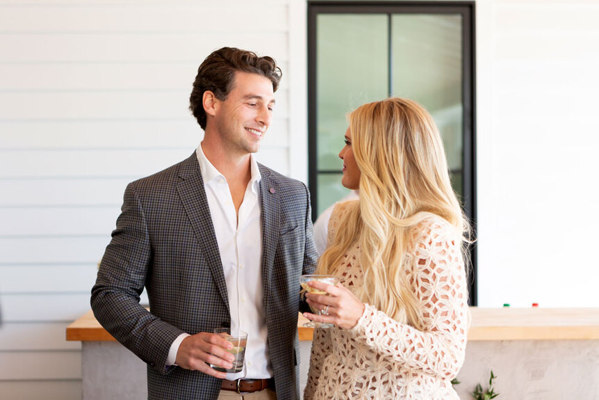 Madison Lecroy and her husband Brett Randle enjoying a drink at a party together.