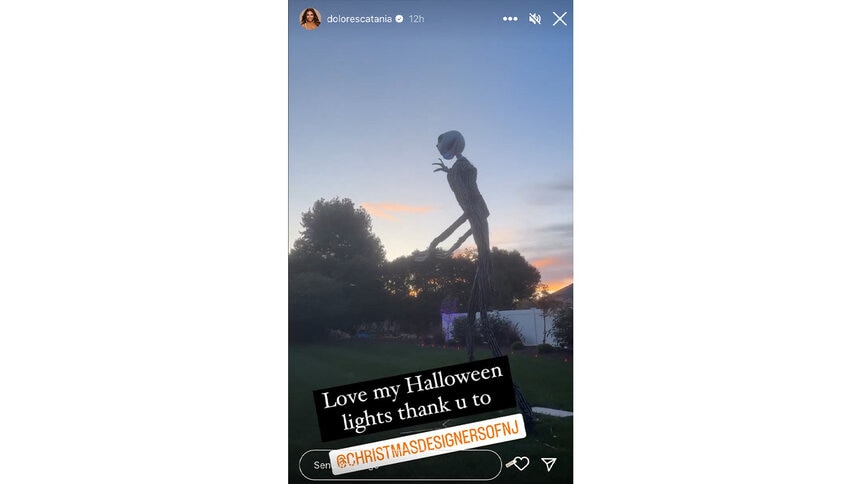 An instagram story of Dolores Catania's Halloween decorations featuring a large Jack Skellington on her yard.