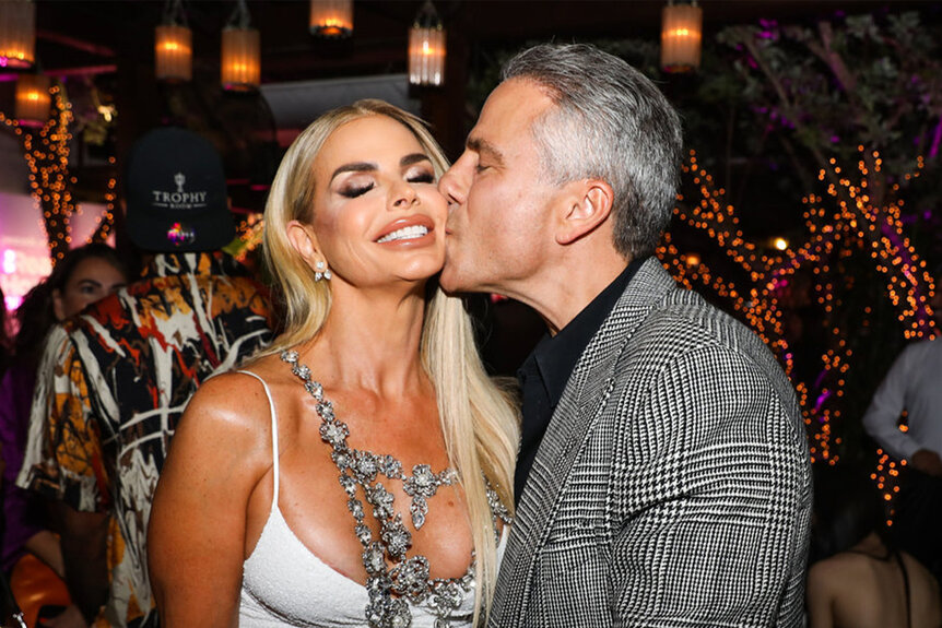 Todd Nepola kisses Alexia Nepola of The Real Housewives of Miami on the cheek.