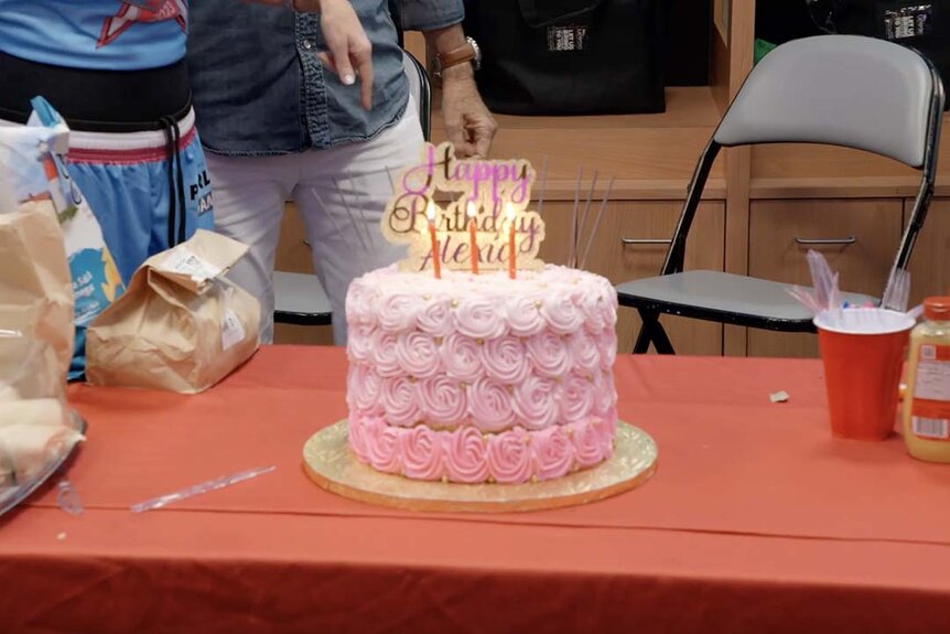 A pink cake with a Happy Birthday Alexia topper appears on The Real Housewives of Miami Season 6 Episode 4.