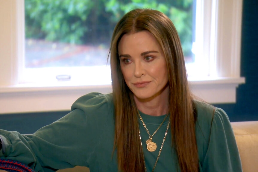 Kyle Richards gets emotional sitting in her living room talking about her sick friend.