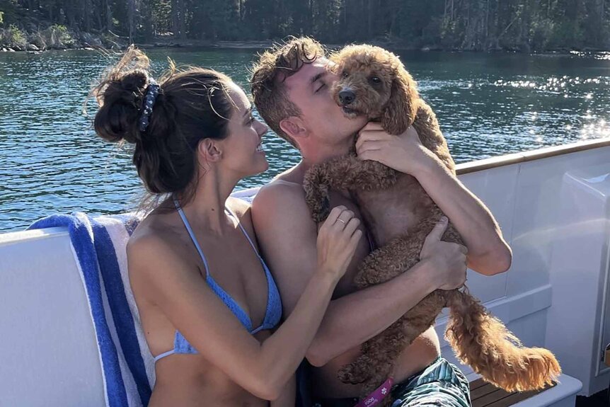 Vanderpump Rules' James Kennedy and Ally Lewber cuddle with their dog Hippie.