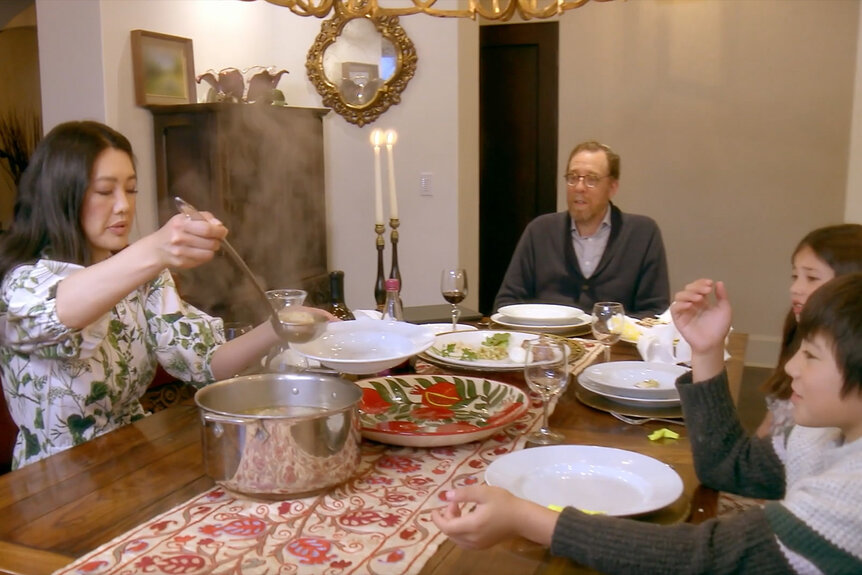 Crystal Kung Minkoff scoops soup into a bowl at a family meal in The Real Housewives of Beverly Hills Season 13 Episode 10.