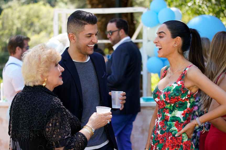 Vida Javid, Nema Vand and Mona Vand laughing while at a party together