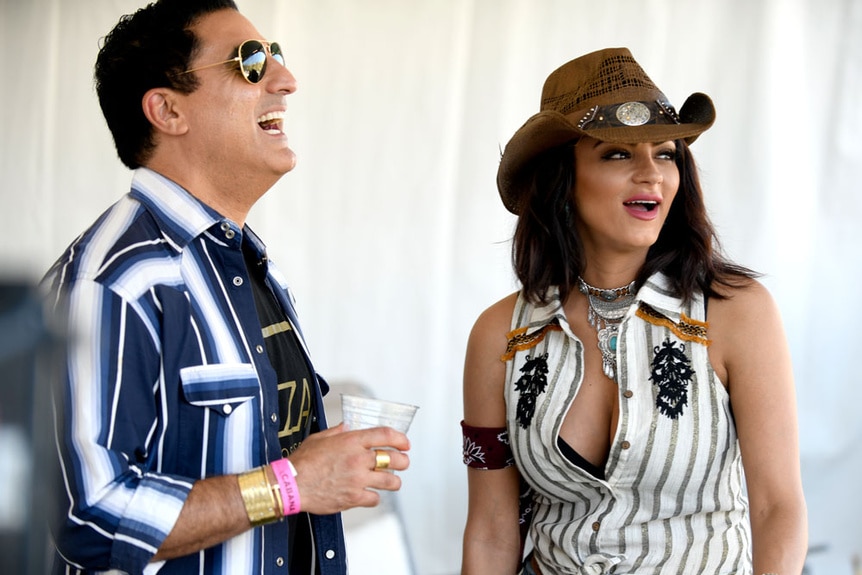 Reza Farahan and Golnesa Gharachedaghi at a country festival together