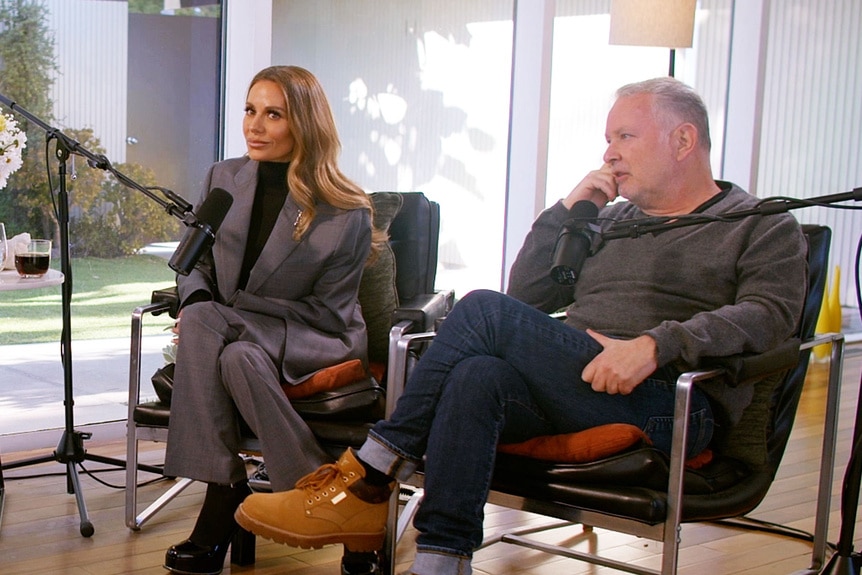 Dorit Kemsley and Paul Kemsley sitting together during a podcast taping.