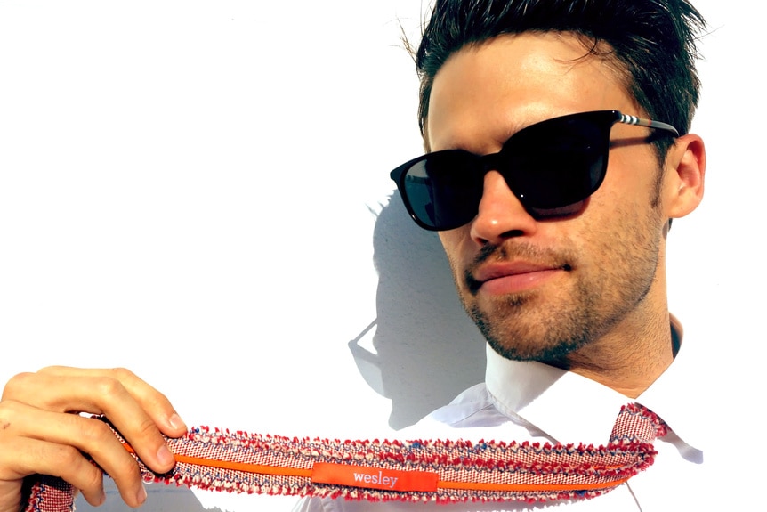 Tom Schwartz modeling sunglasses and a tie
