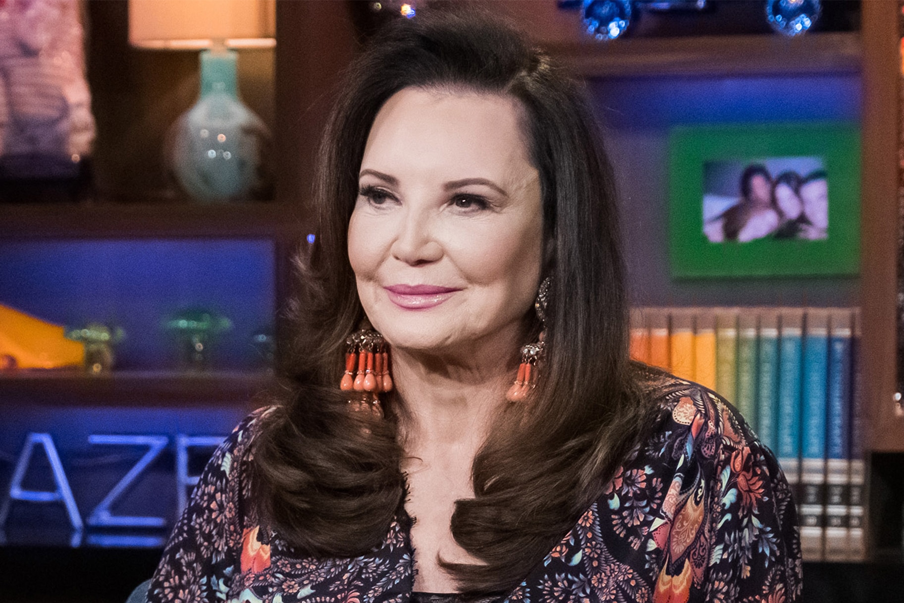 Patricia Altschul Wears a Black One-Piece Swimsuit on a Flamingo Float