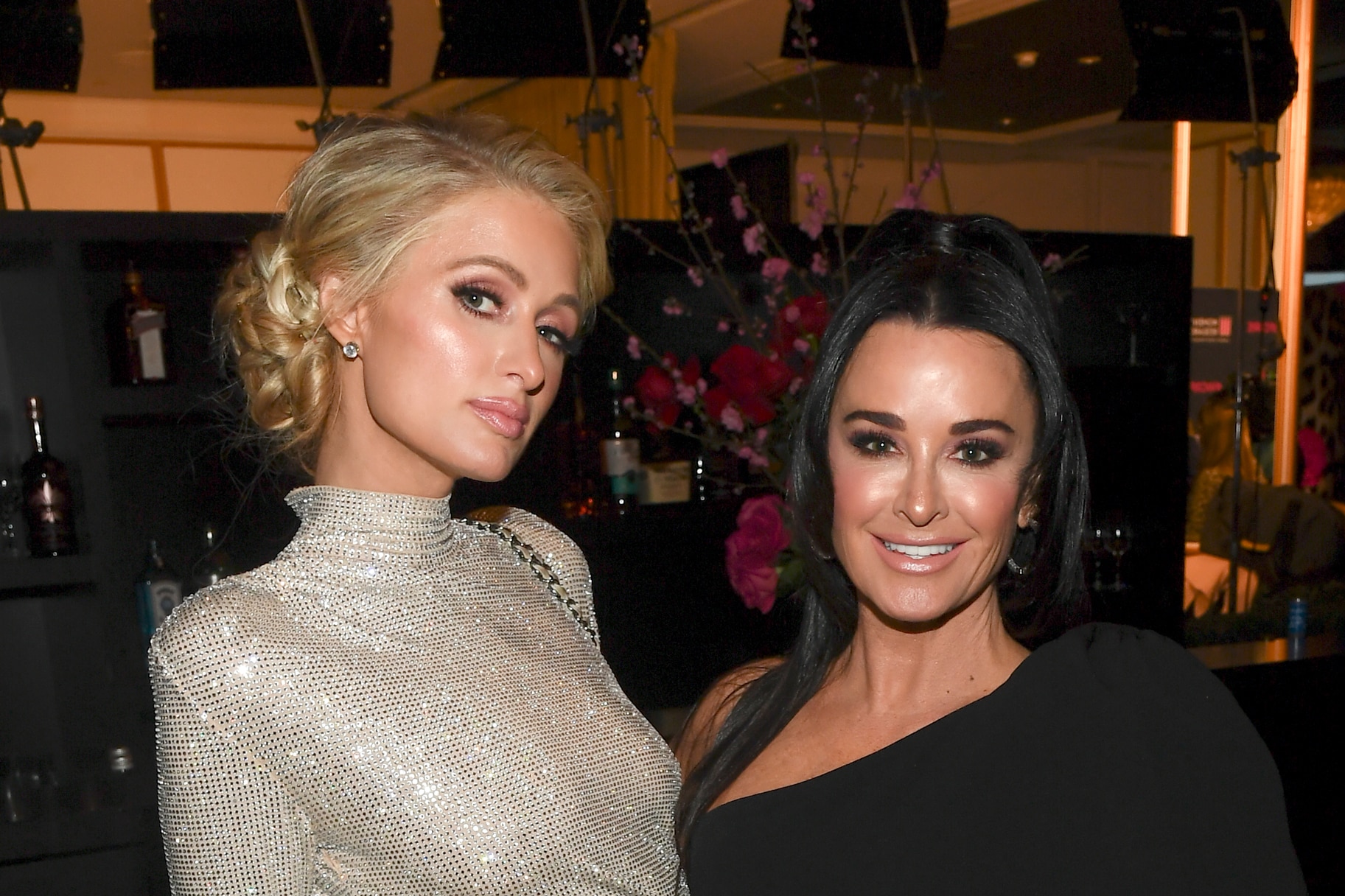Kyle Richards and Paris Hilton pose for a photo together.