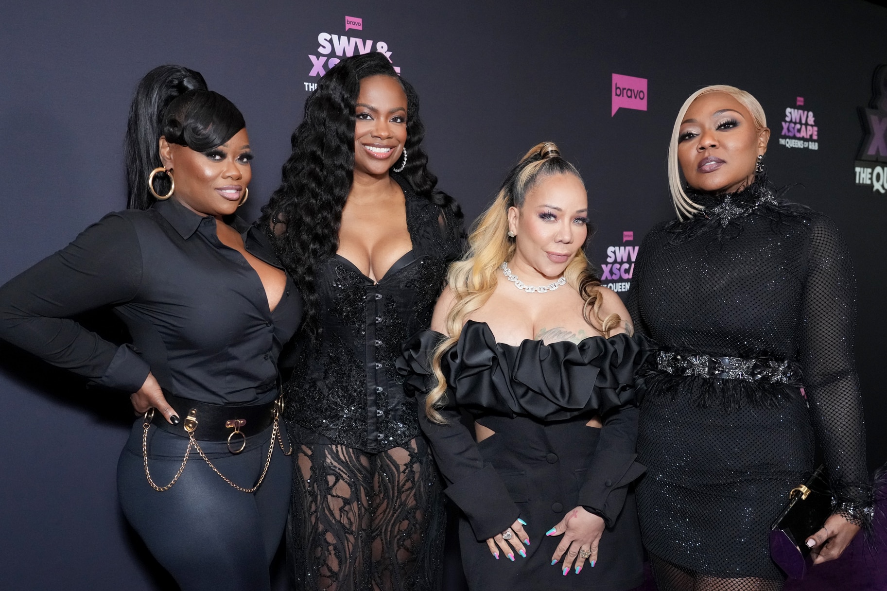 Xscape music group posing together at event