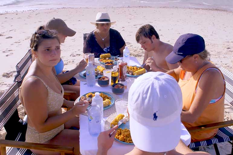 Charter guests eat food at a picnic table on Below Deck Down Under 210