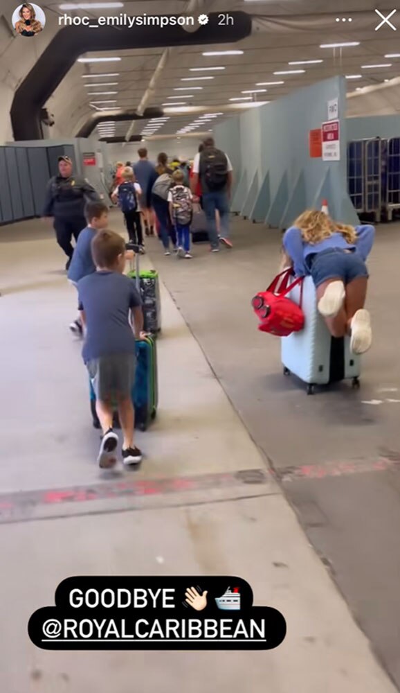 Emily Simpson’s children with their suitcases leaving a cruise vacation.