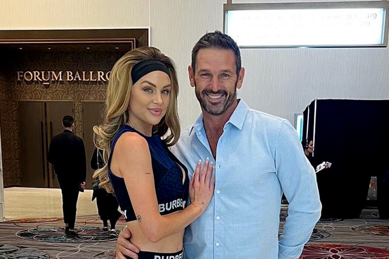 Lala Kent and Jason Chambers, with their arms wrapped around each other while at BravoCon 2023 together.