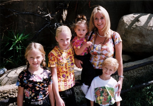 Kim Richards outside with all four of her children