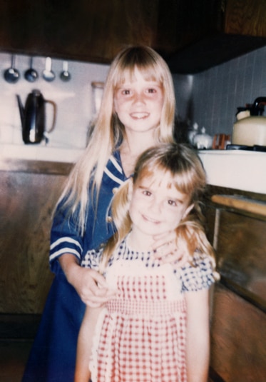 Kyle Richards as a little girl with her sister, Kim Richards.