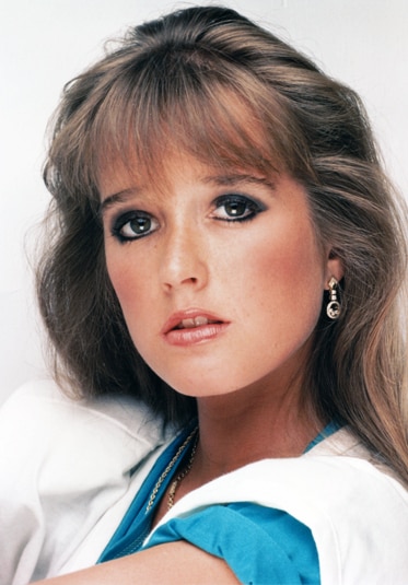 Kim Richards as a young model with a full face of makeup.