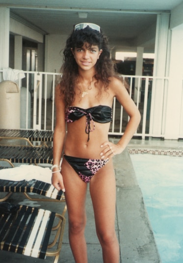 Teresa Giudice as a teenager in a bikini next to a pool