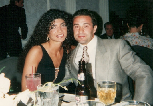 Teresa Giudice and Joe Giudice smiling at dinner