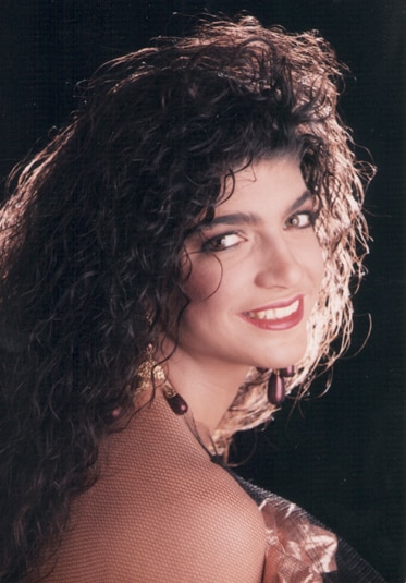 A young Teresa Giudice looks over her shoulder