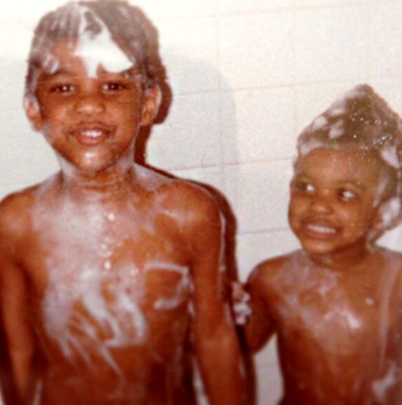 Porsha Williams in the bath with her older brother as children.