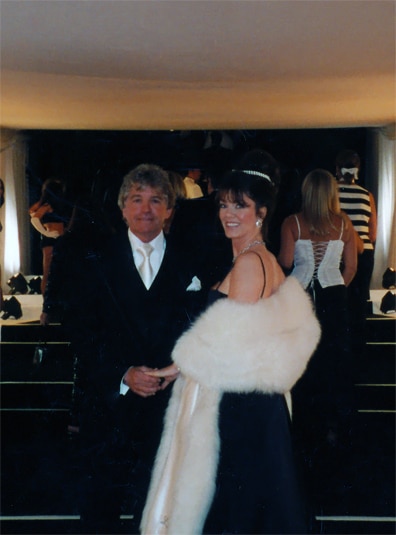Lisa Vanderpump and Ken Todd smile for the camera while wearing formalwear.