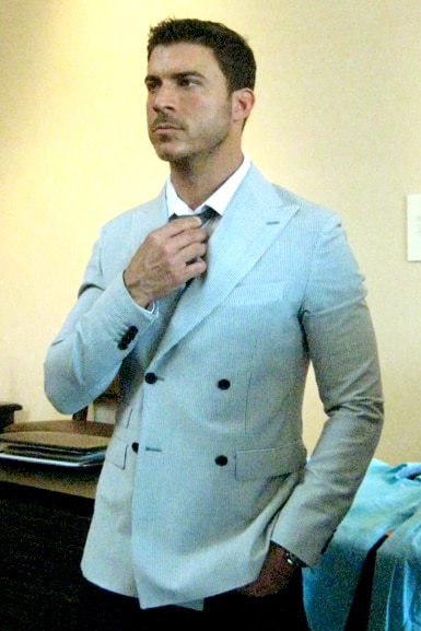 Jax Taylor wearing a suit coat and tie.