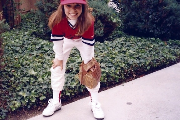 Scheana Shay wears a baseball uniform as a young girl.
