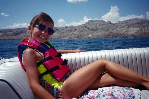 Scheana Shay relaxes on a boat while wearing a life jacket.