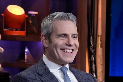 Andy Cohen smiling on the set of Watch What Happens Live