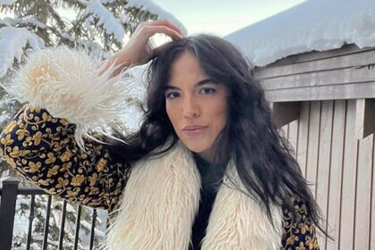 An Instagram photo of Danielle Olivera standing outside with a fur-lined coat