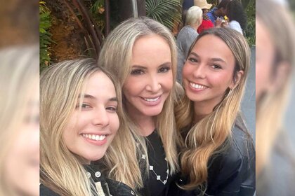 Shannon Storms Beador posing for a photo with her twin daughters.