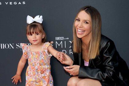 Scheana Marie smiles on the red carpet with her daughter Summer Moon