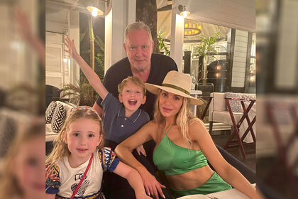 Dorit Kemsley her husband, Paul Kemsley, and their children pose for a photo together.