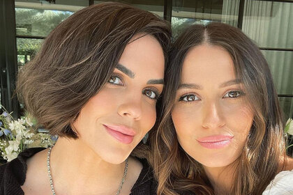 Katie and Kristina smile together in a selfie.