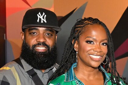Kandi Burruss and Todd Tucker pose for a photo together.