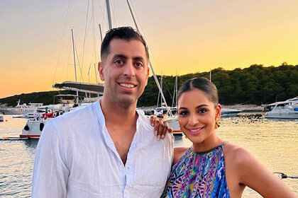 Jessel Taank and her husband Pavit Randhawa outdoors at a seaside marina together.