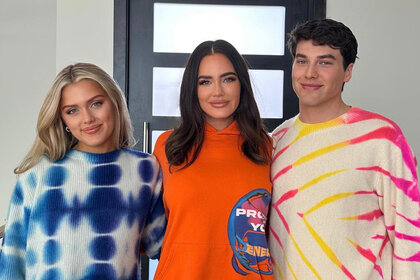 Chloe Marks, Meredith Marks, and Brooks Marks smile while wearing colorful sweaters.