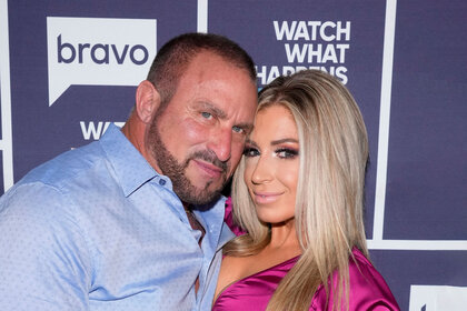 Frank Catania and Brittany Mattessich in front of the Watch What Happens Live step and repeat together.