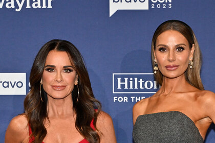 Kyle Richards and Dorit Kemsley in front of a step and repeat at BravoCon 2023.