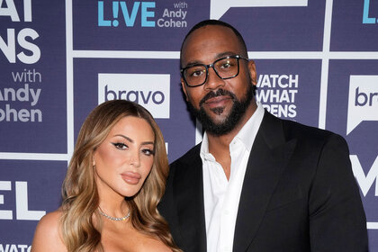 Larsa Pippen and Marcus Jordan posing together in front of a step and repeat at the Watch What Happens Live clubhouse in New York City.