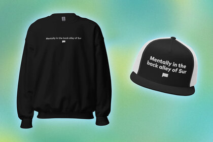 A sweatshirt and a hat with quotes overlaid onto a colorful background.